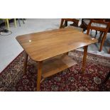 A vintage sapele coffee table approx 76 x 46cm with splay legs and undertier