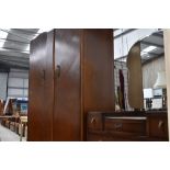 A mid 20th Century oak and ply wardrobe and dressing table