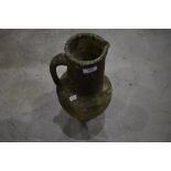 A concrete garden ornament modelled as Grecoromanesque ewer