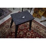 A Victorian carved stool or occasional table