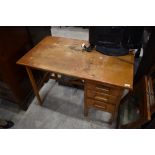 A vintage golden oak desk, nice proportions, width approx, with three drawers and blotter slide ,