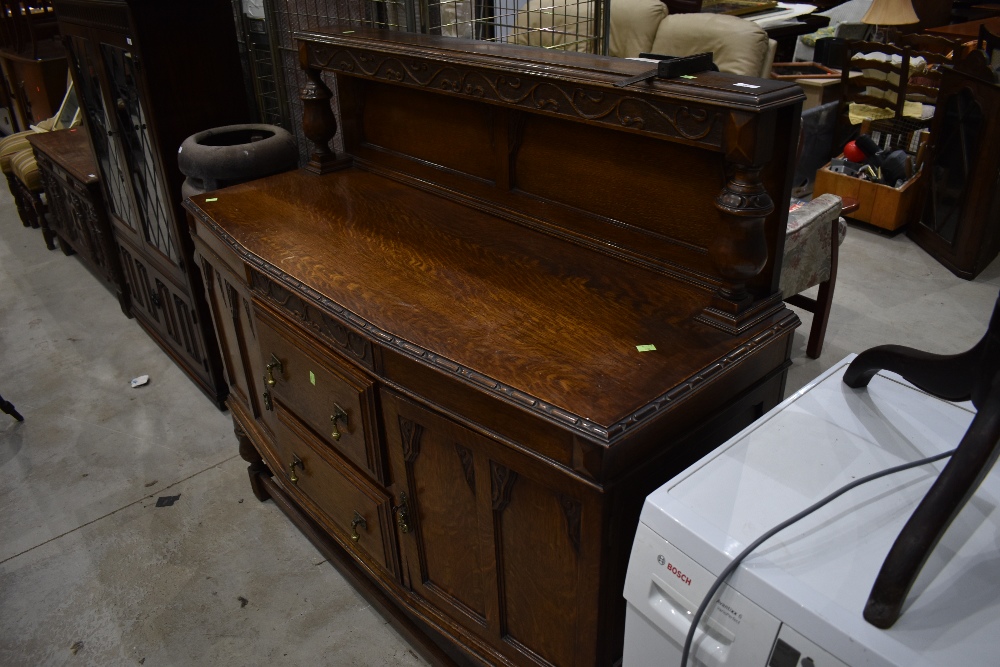 An early 20th Century oak sideboard having ledge back, approx. width 136cm