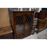 A mid to late 20th Century oak display cabinet, possibly Old Charm, width approx. 97cm, height