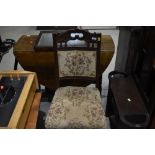 A Victorian mahogany dining chair having overstuffed seat and back and later upholstery