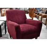 A modern tub chair, in burgundy, labelled for John Lewis