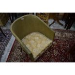 A vintage woven fibre tub chair