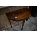 An early 20th Century mahogany half moon table, of small proportions, on spade feet, width approx.