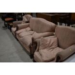 An early 20th Century three piece lounge suite having mahogany frame, good sound frame, some