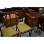 An Edwardian mahogany and inlaid pot cupboard and pair of similar bedroom chairs