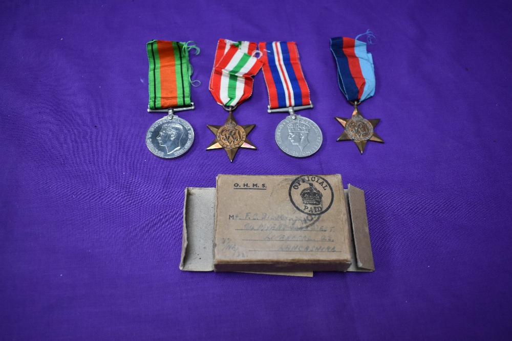 A group of four WW2 Medals, Defence Medal, War Medal, 1939/45 Star and Italy Star, in original box