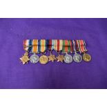 A group of WW1 and WW2 miniature medals, 1914-15 Star with clasp 5th Aug-22 Nov 1914, War Medal,