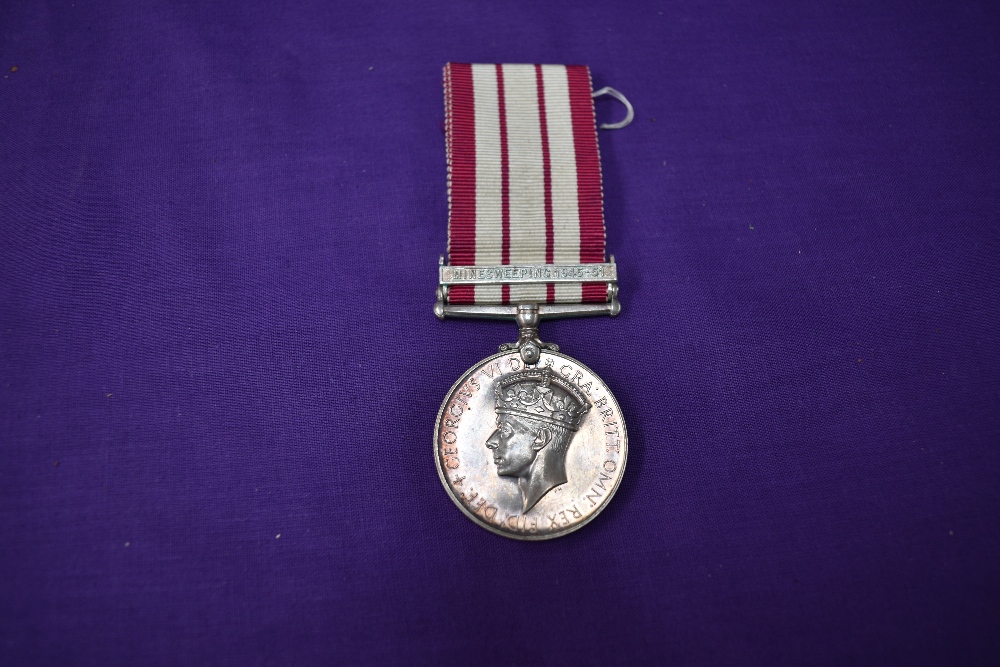 A Naval General Service Medal, unnamed, with Minesweeping 1945-51 bar