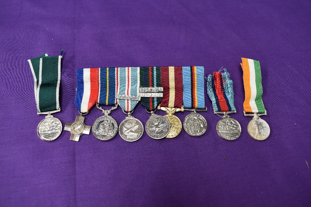 A group of six miniature medals, General Service Cross, National Service Medal, British Army of