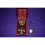 A French WW1 Croix de Guerre 1914/18 Medal with ribbon and having two stars along with a white metal
