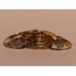 A lady's dress ring having a diamond chip cushion cluster on a yellow metal loop stamped 18ct,