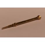 A Victorian yellow metal propelling pencil having citrine set terminal and engraved decoration, no