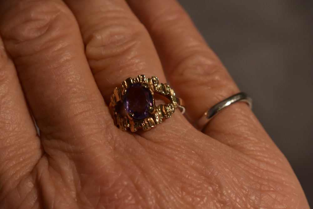 A lady's dress ring having an oval amethyst in a stylised open mount on a 9ct gold loop, size N & - Image 4 of 4