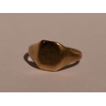 A 9ct gold signet ring of plain form, size M and 2.2g