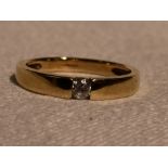 A lady's dress ring having a tension set cubic zirconia in a 14ct gold band, size M &approx 2.7g