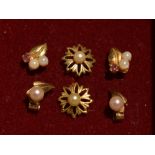 Three pairs of 9ct gold and yellow metal stud earrings having seed pearl decoration, approx 1.9g