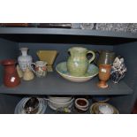 An assortment of studio pottery including jugs, vases and cruet set.
