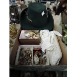 A collection of vintage costume jewellery, a box, a hat and a pair of vintage gloves and bag.