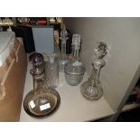 A selection of clear cut and antique glass decanters including Caithness Scotland