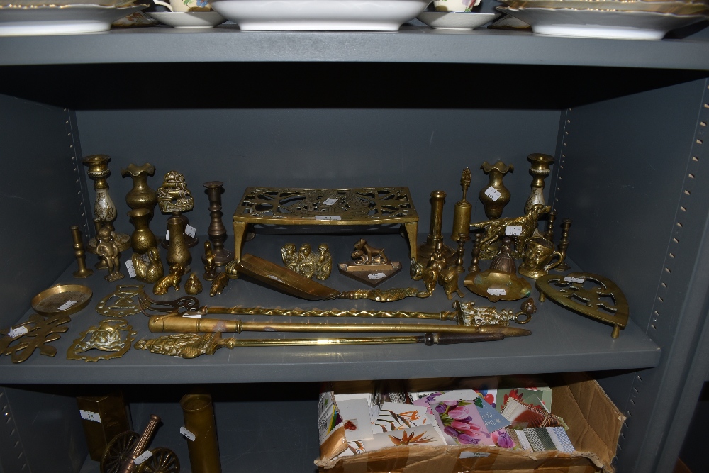 A large collection of brass including trivets,horse brasses,animal figures,vases and more.