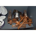 A selection of hand tools including A bailey 4 1/2 smoothing plane, two similar planes and a