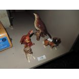 A Beswick song thrush,Goebel rabbit with lady bird on tail and two boxer dog figurines.