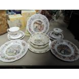 A collection of Royal Doulton Brambly hedge plates and cups and saucers, also included in a