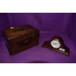 An antique mahogany veneered tea caddy having three internal compartments and a small Mahogany