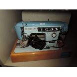 A vintage brother sewing machine and case serial number M768432.