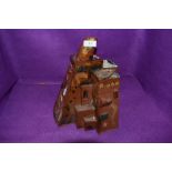 A abstract piece of glazed terracotta pottery, in the style of a cluster of buildings.