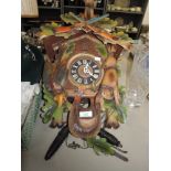 A German cuckoo clock having hunting theme.