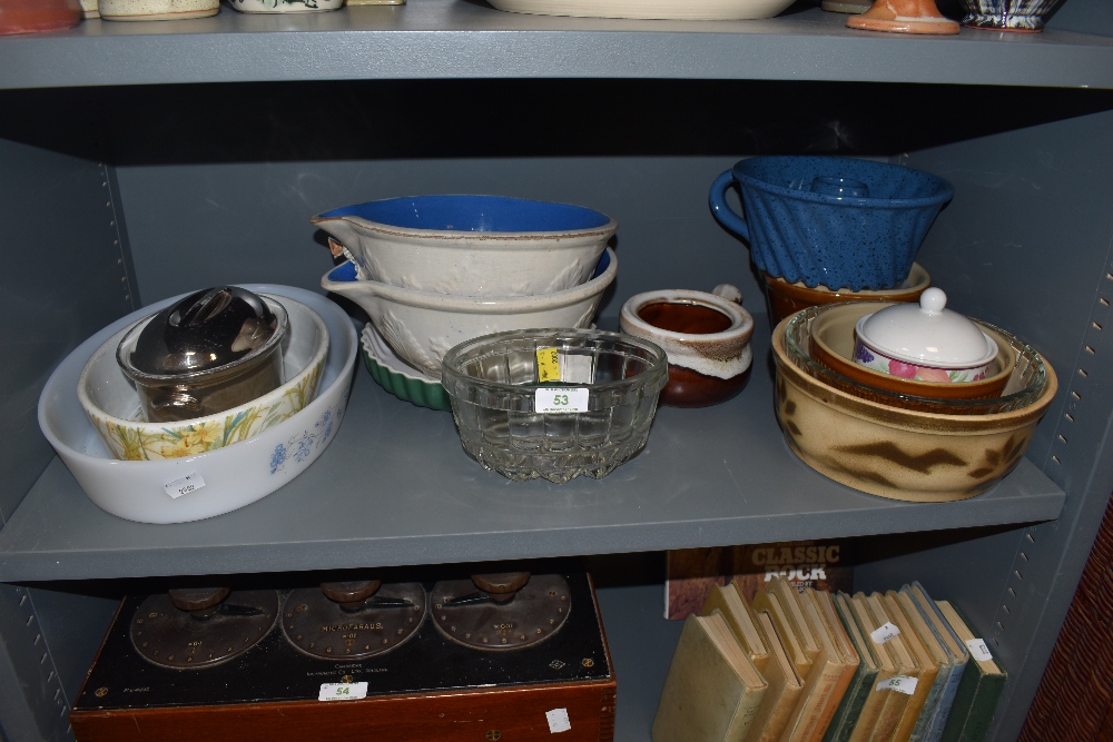 A mixture of kitchen ware amongst which are vintage earthen ware mixing bowls,jelly mould,dishes and