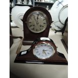 A small antique bracket or mantle clock with oak case and similar modern example