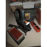 An antique boxed Fine Magic Lantern with extra slides and accessories