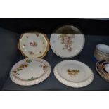 A selection of vintage dessert serving plates having bright floral patterns,five in total.