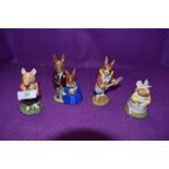 Four Royal Doulton Bunnykins and Brambly Hedge figures, Family Photograph DB1, Strumming DB16,