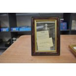 A framed photograph, 1930's English cricketer Douglas Jardine along with a business card bearing