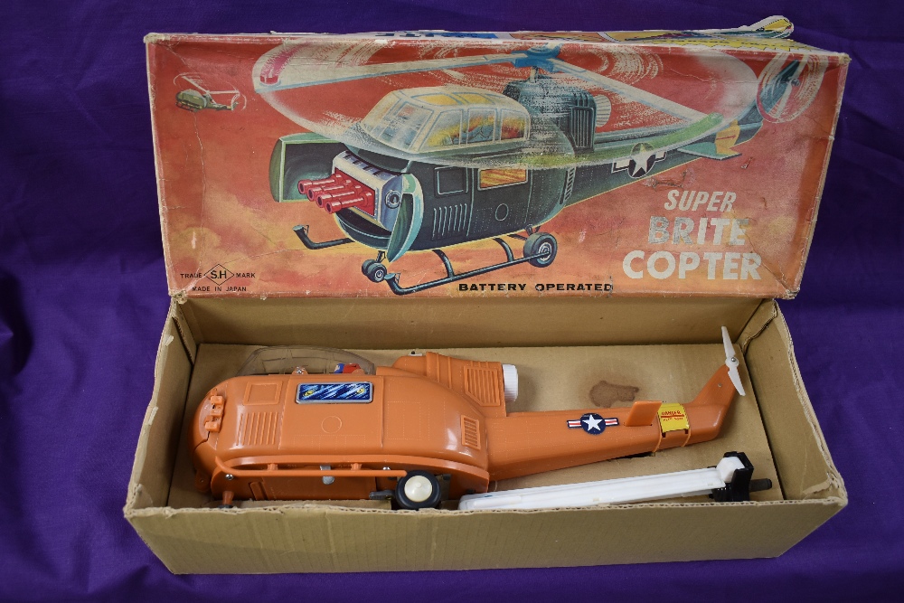 A 1960's SH (Japan) plastic and battery operated Super Brite Copter, in original box with inner card