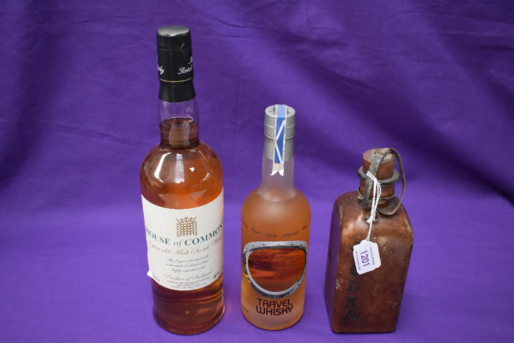 A bottle of House of Commons 8 year old Malt Scotch Whisky, 70cl, 40% vol, a 35cl bottle of Pure