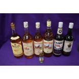 Three One Litre bottles of Whisky, Bells, High Commissioner and Famous Grouse, a 70cl bottle of