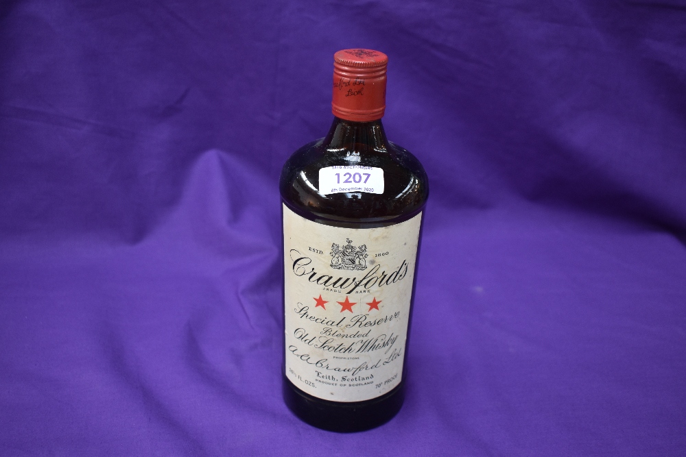 A bottle of Crawfords Special Reserve blended old scotch whisky, 26 2/3 fl.ozs, 70% proof