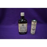 A bottle of Gordon's Special Dry London Gin 13 1/3Fl Ozs 70% proof and a miniature bottle of