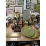 An collection of items including brass lamp with spaniels to base,two mirrors,trays, candlestick