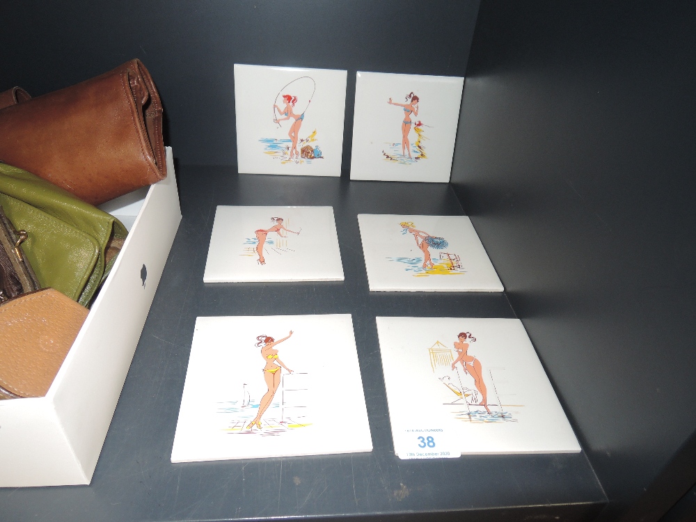 Six collectable mid century tiles, each having a different bikini clad pin up on.