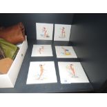 Six collectable mid century tiles, each having a different bikini clad pin up on.