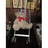 A vintage childrens Play buggy and teddy bear